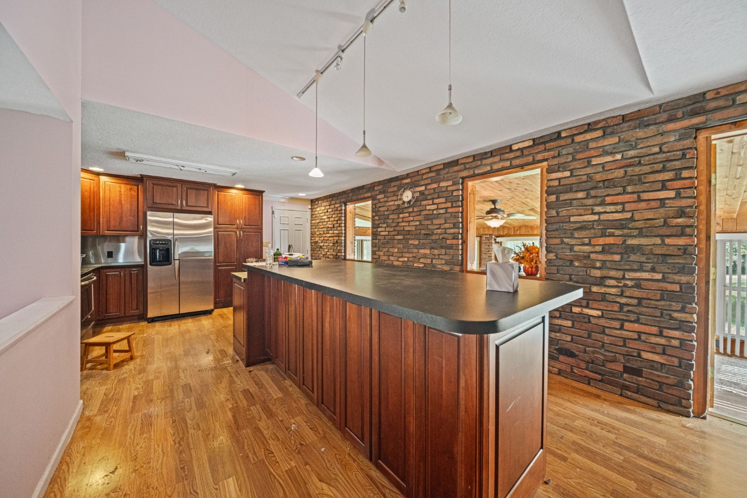 Kitchen with wood cabinetry and center island