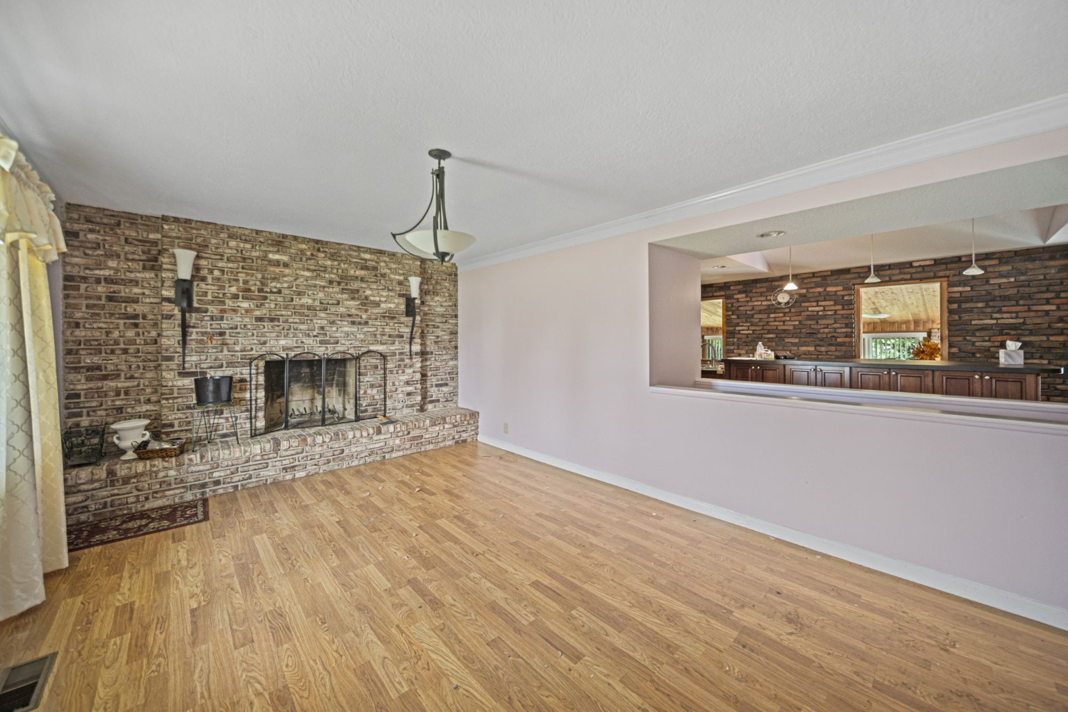 Living room with brick fireplace