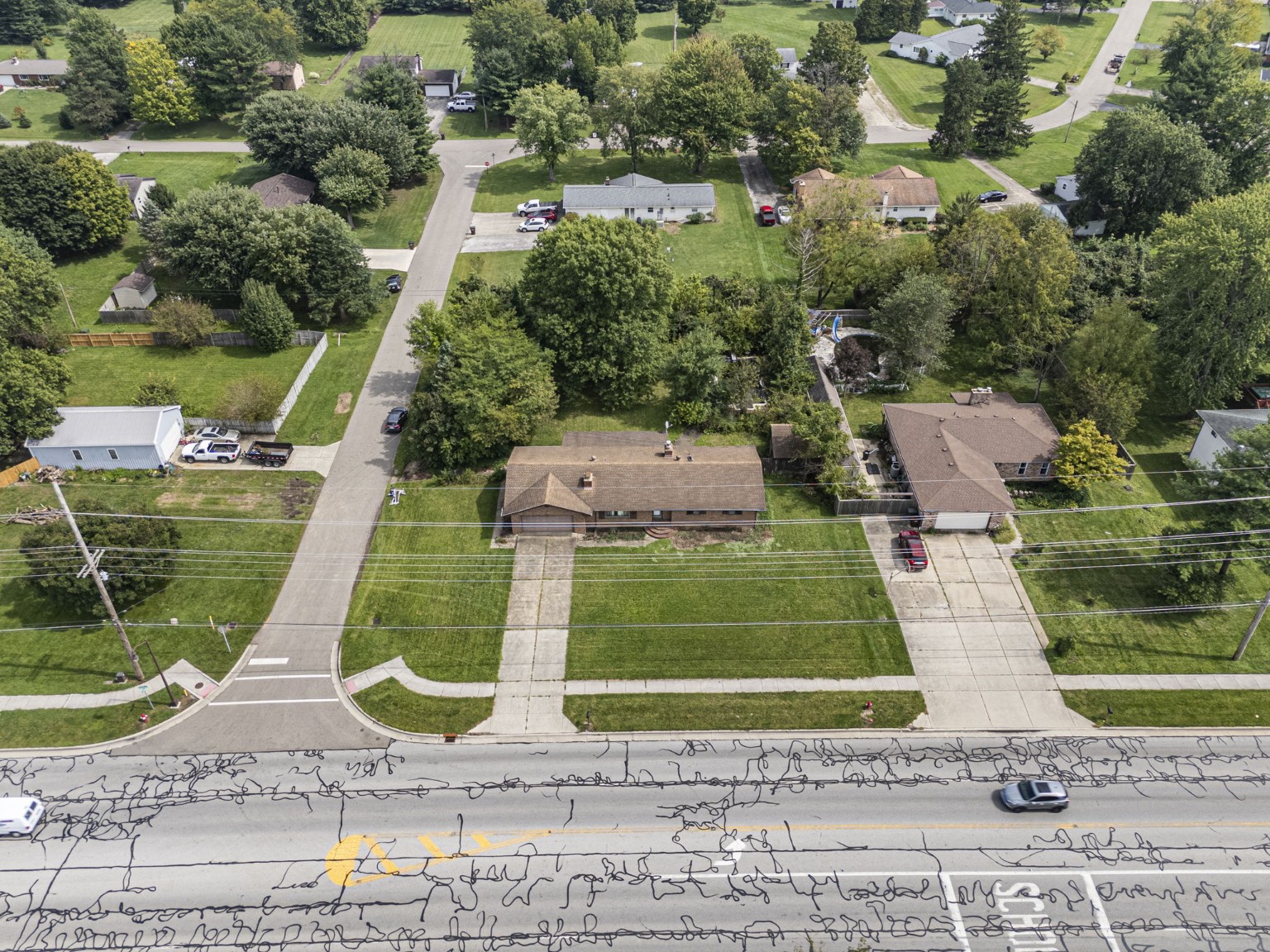 Aerial view of the home and neighborhood